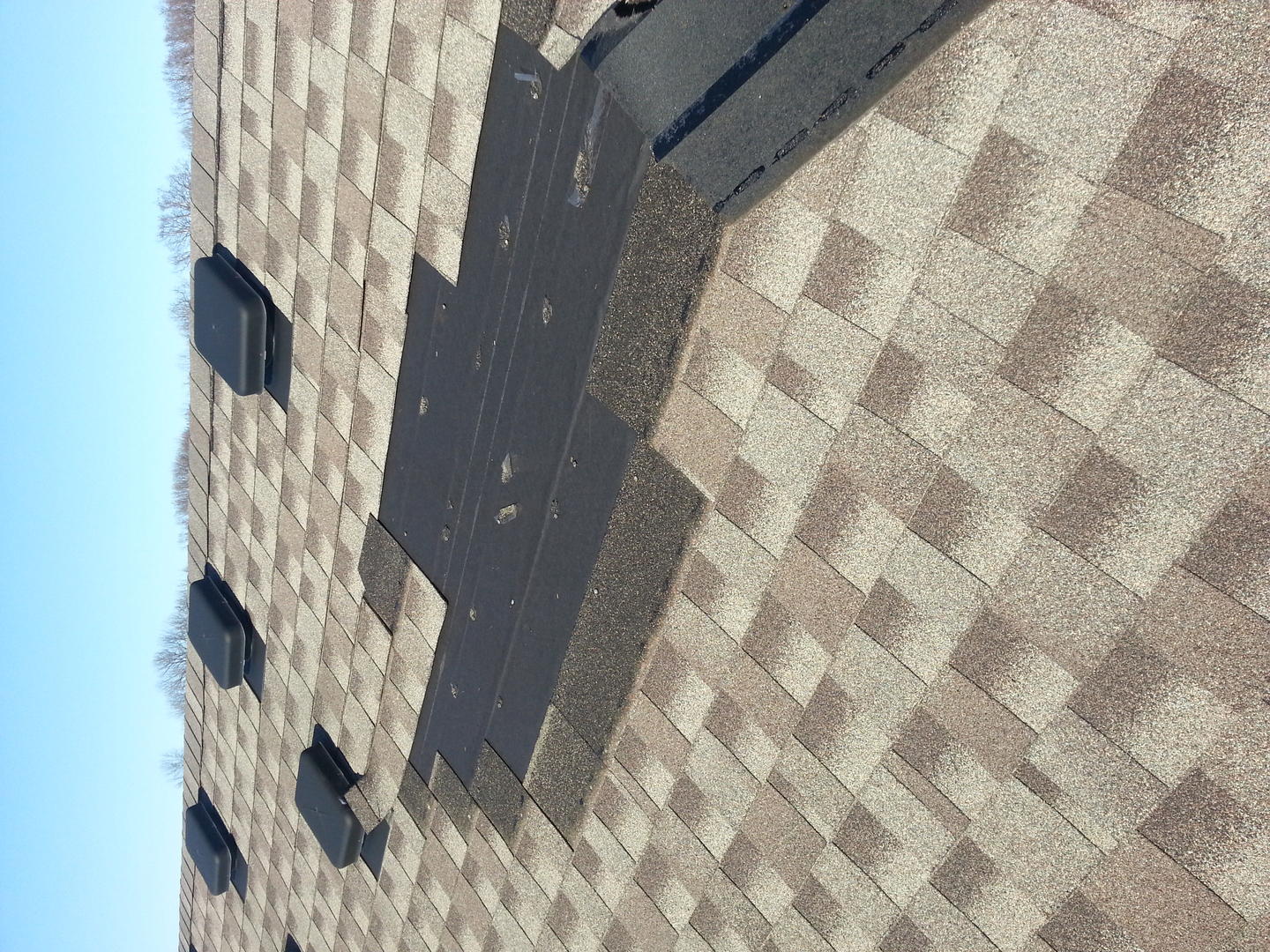 Roof repair work being performed by Republic Roofing technicians